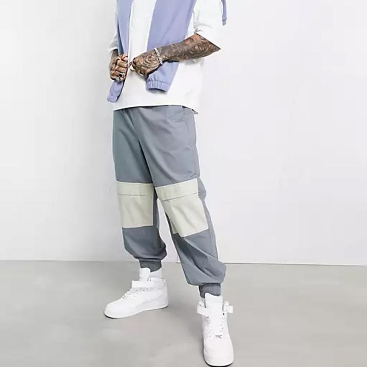 OEM custom side pockets design drawstring waist men's  pants gray oversized contrast panels tapered pants